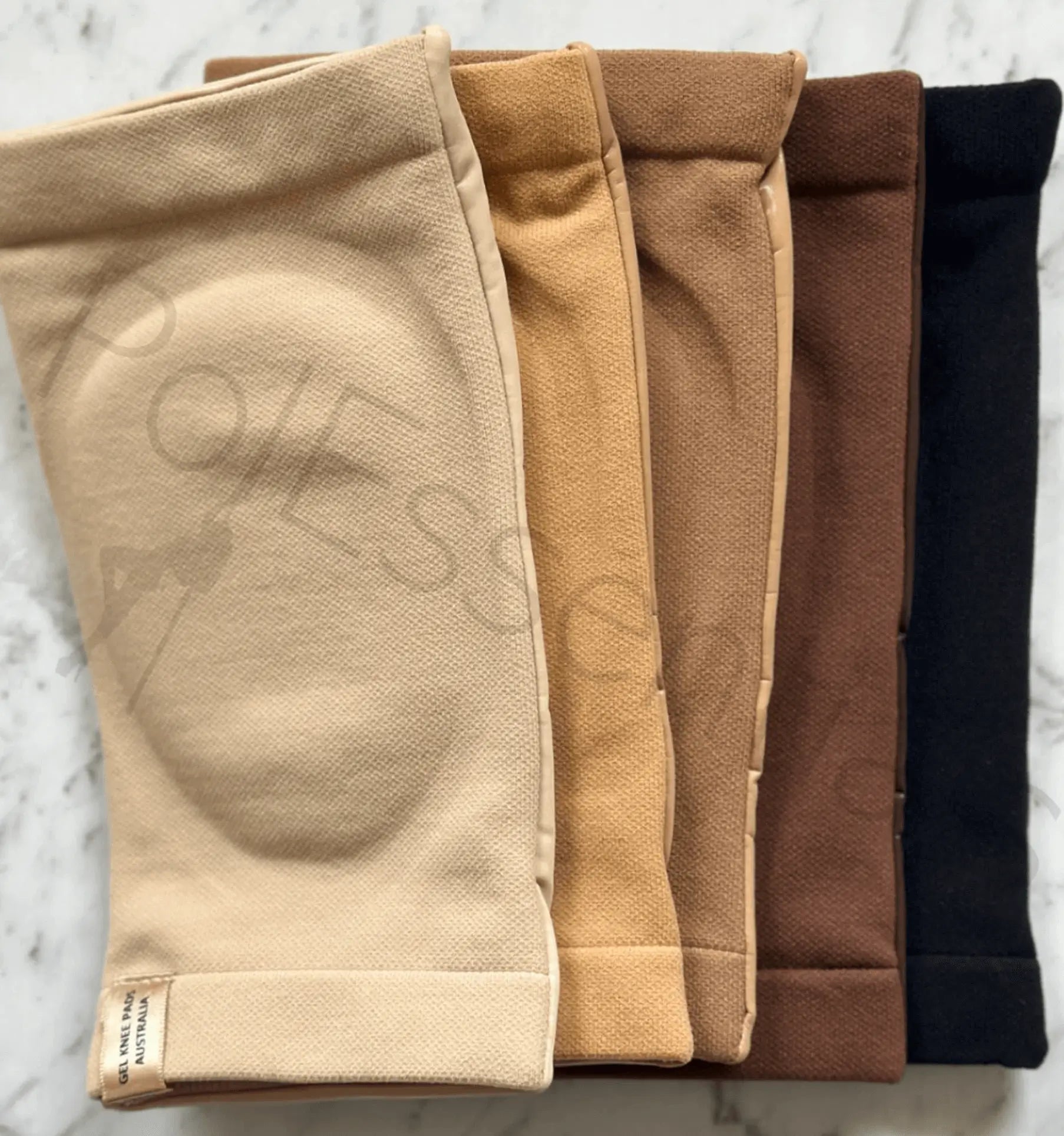 PolEssentials Gripp Gel Knee Pads showing all 5 colors in Light Beige, Tan, Light Brown, Brown, and Black knee pads for pole dancing.